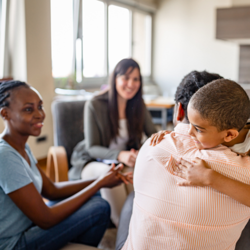 Support specialist with family during home visiting session